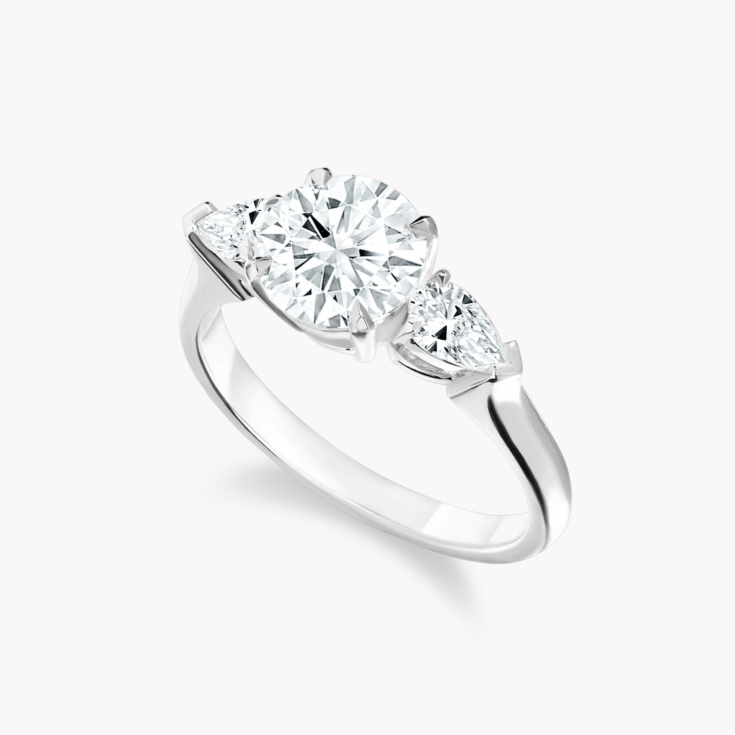 Round -Cut Diamond  Ring with Pear Side Diamonds
